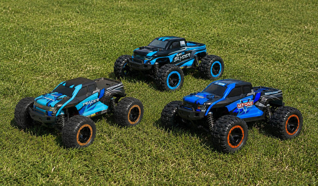 MT-One, Tracer and Slyder RC Trucks on Grass